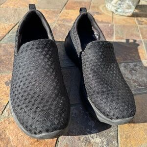 Skechers black slip-ons, size 7